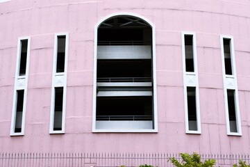 Pink painted building wall texture background