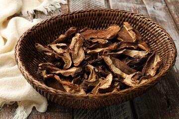 Dried chanterelle mushrooms on wooden table, closeup