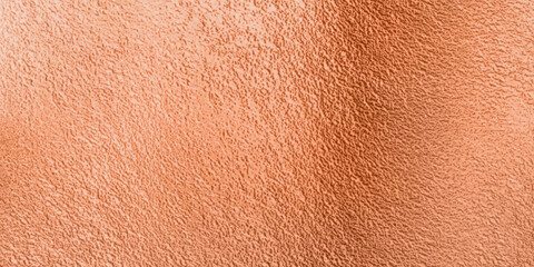 A close-up view of a textured, copper-colored surface. Shade from light to dark orange-brown, rose cold, brass, with a subtle variation in tones and modern, elegant surface background.
