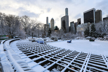 Winter view of Central Park, New York covered in snow during early morning
