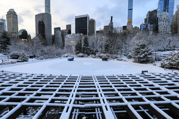 Winter view of Central Park, New York covered in snow during early morning