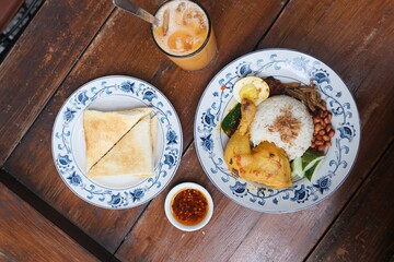 Traditional nasi lemak and sarikaya toast breakfast set
