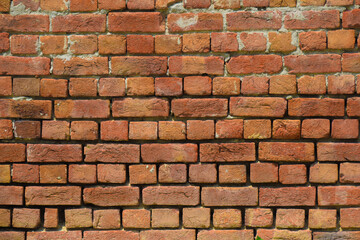 brick wall old red brick wall with dust and debris on white background. Broken brick wall with scattered debris and visible cracks.
