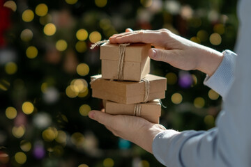 Christmas gift boxes in children's hands