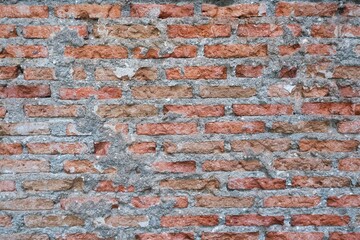 Old red brick wall with mortar texture