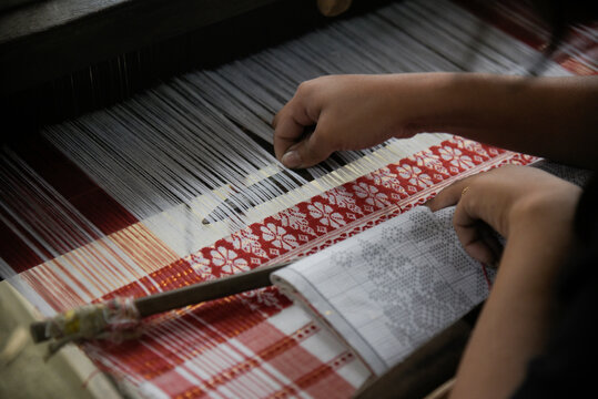 weaving Assamese traditional Gamosa during Bihu festival