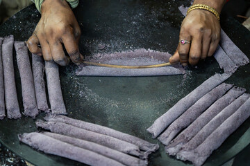 Making of Assamese traditional pitha during bihu