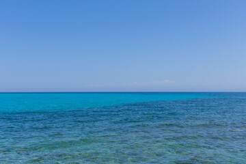 Beautiful turquoise sea on the background of blue sky.