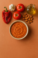 Romesco Sauce in Ceramic Bowl with Ingredients – AI-generated