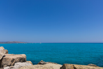 Seascape with blue sky and white yachts in the distance