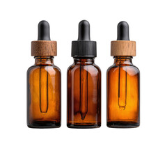 Trio of 1oz amber glass dropper bottles on stone, isolated on transparent background