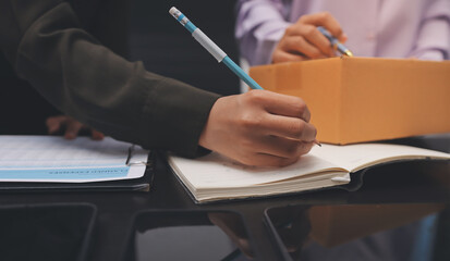 Portrait of Starting small businesses SME owners, two Asian woman check online orders Selling...