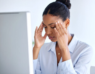 Woman with tired eyes rubbing her temples while looking at a monitor, plain blouse, white background, soft lighting