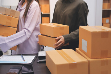 Portrait of Starting small businesses SME owners, two Asian woman check online orders Selling...