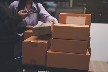 Portrait of Starting small businesses SME owners, two Asian woman check online orders Selling...