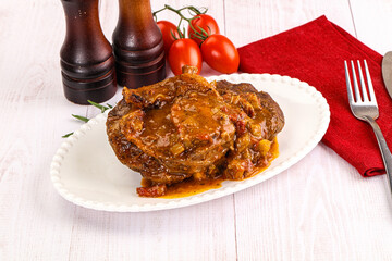 Italian cuisine - ossobuco with sauce