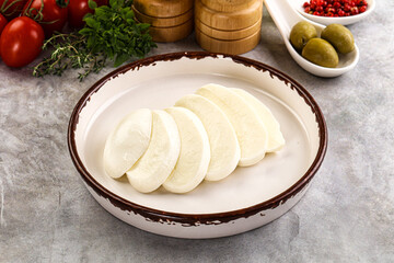 Organic mozzarella cheese slices in the plate