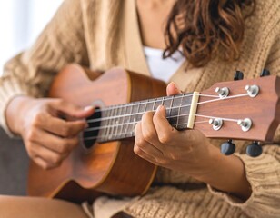 Obraz premium Woman playing ukulele