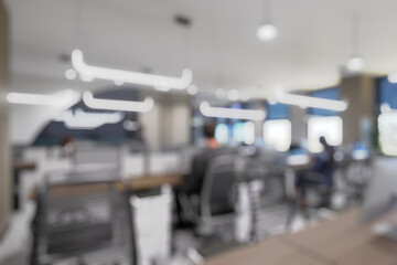 Blurred modern office interior with open space design. Rows of workstations and minimalistic...