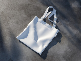 White Blank Canvas Tote Bag Mockup 3D Rendering on a Asphalt