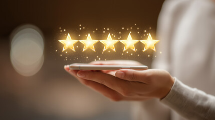 Five star rating feedback on mobile device with glowing golden stars