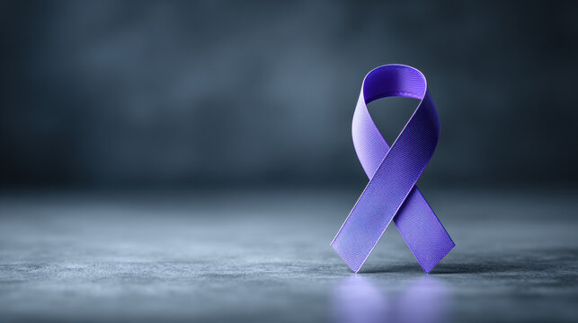 Purple awareness ribbon on textured surface symbolizes support and solidarity