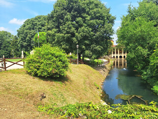 Salvi Park with a river and greenery in the city of Vicenza.