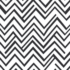 A seamless pattern of simple chevron lines, creating an elegant and modern design on a white background.