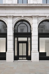 Obraz premium Elegant storefront with large arched windows and classic architecture, showcasing modern design elements in an urban setting during the day