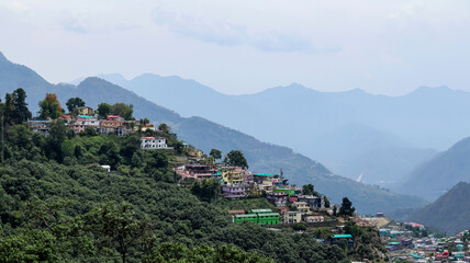 Panoramic view of Gopeshwar town set against the mountain range backdrop in Chamoli district, Uttarakhand, India.