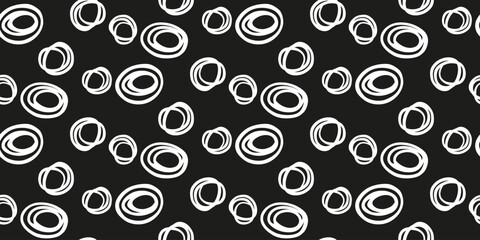 Seamless vector pattern with abstract hand drawn circles in white on a black background. Modern, bold, and stylish design, perfect for textiles, wallpapers, branding, and creative projects.