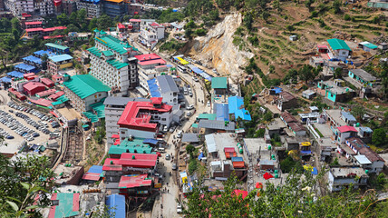 Scenic view of Sonprayag town punctuated with parked vehicles, located in Rudraprayag district of Uttarakhand, India.