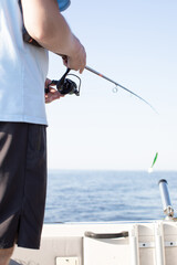 fisherman fishing, Fishing rod, spinning, fisherman against blue sky