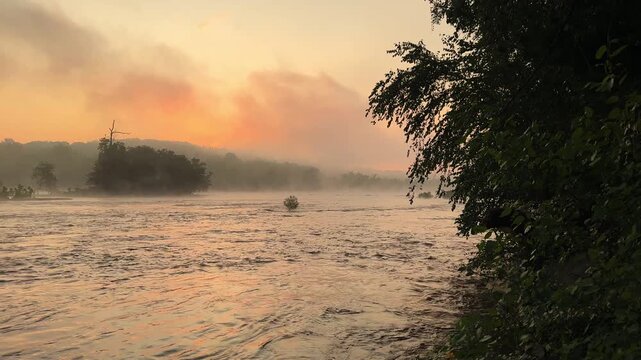 Wide shot of the James River during a misty summer sunrise (Pony Pasture Park)