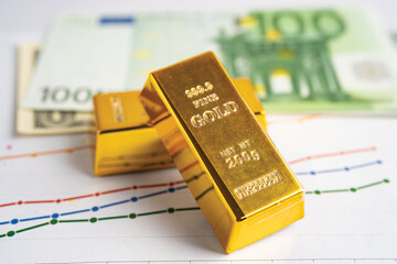 Gold bar on graph with EU banknote, economy finance exchange trade investment.