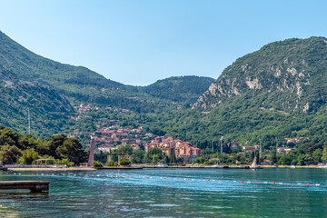 A scenic view of the coastal town of Kotor, Montenegro, nestled between lush green mountains and...