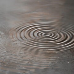 Fototapeta premium Water Droplet Impacts Creating Spiral Ripple Distortions, Circular Wave Patterns on Surface with Gray Background