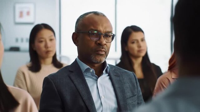 A diverse group of professionals focused on a business discussion.