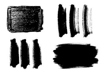 Vector art of a collection of black brush strokes and paint splatters