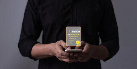 Customer Review, Young Man hand holding Smart Phone with five star to review and give 5 stars with very good results in service, Good review 5 star rating choice feedback