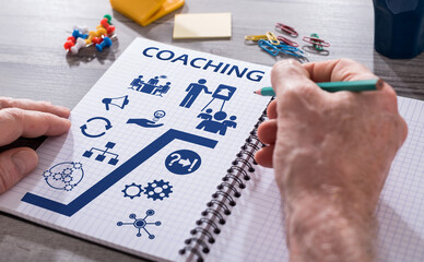 Coaching concept on a notepad