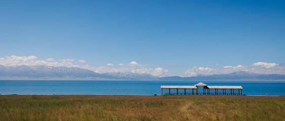lakeview with cloud capped mountains and gazebo