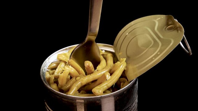 Fork Lifting Haricot Beans from Open Canned Food