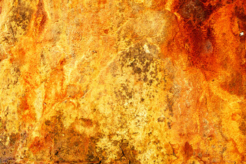 Macro texture of rusted steel surface with patina effects and color transitions from orange to brown, great for high-resolution background needs. Detailed corrosion on metal with organic texture