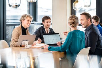 Business colleagues having discussion at table
