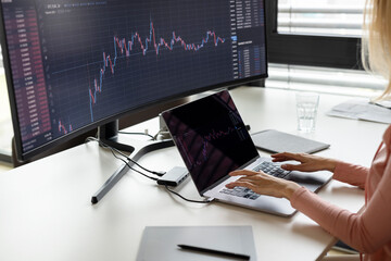 Businesswoman working on laptop at desk