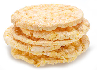 Puffed corn cakes or rice cakes isolated on white. Alternative snack for bread product.