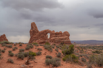 Turret Arch in Arches National Parkon a moody cloudy day