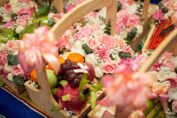 Fruit basket decorated with flowers
