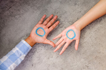 Close-up Of Hands With Blue Rings On Palms